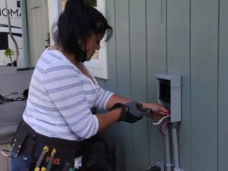 Licensed electrician wiring an exterior subpanel in Little Egg Harbor